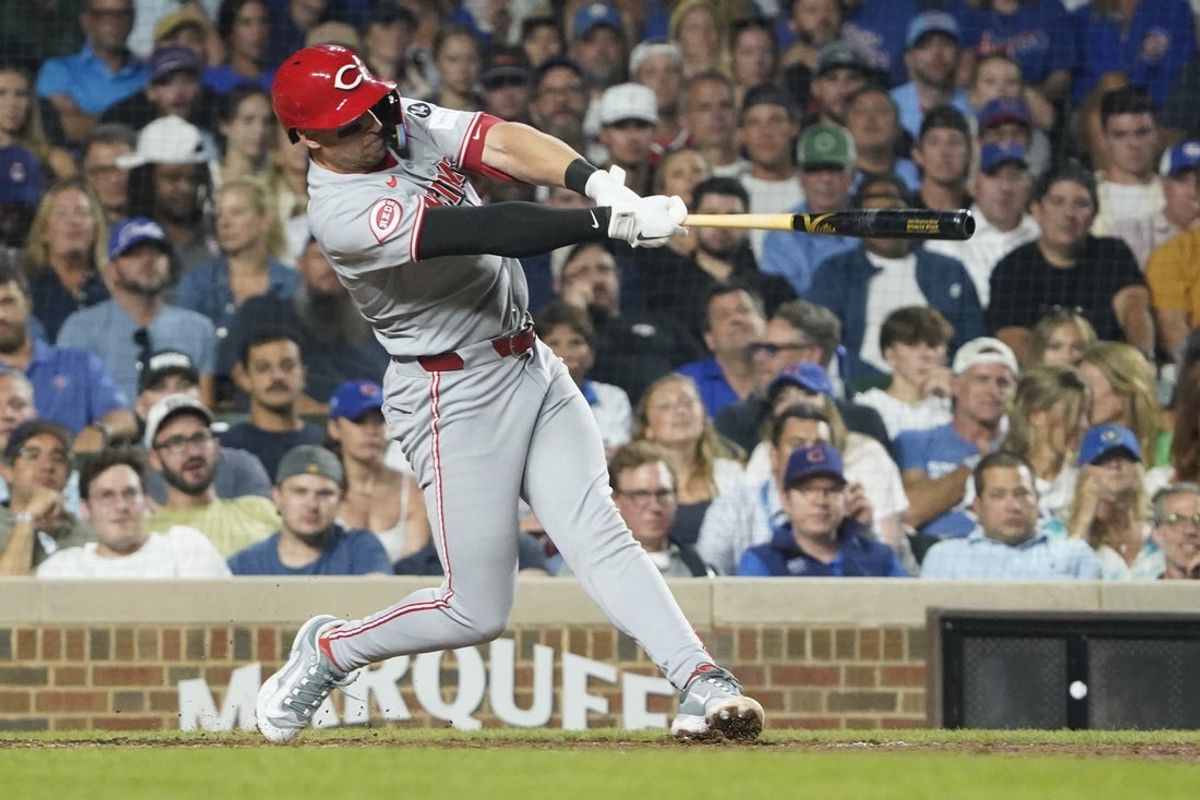Aug 5, 2025; Chicago, Illinois, USA;  Cincinnati Reds first base Spencer Steer (7) hits a home run during the seventh inning against the Chicago Cubs at Wrigley Field. Mandatory Credit: David Banks-Imagn Images