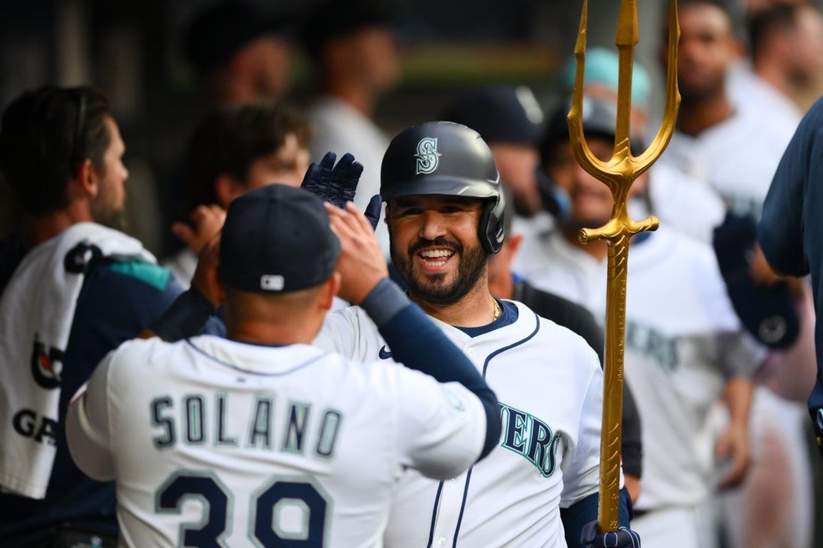 Aug 5, 2025; Seattle, Washington, USA; Seattle Mariners third baseman Eugenio Suarez (28) celebrates in the dugout after hitting a 2-run home run against the Chicago White Sox during the fourth inning at T-Mobile Park. Mandatory Credit: Steven Bisig-Imagn Images