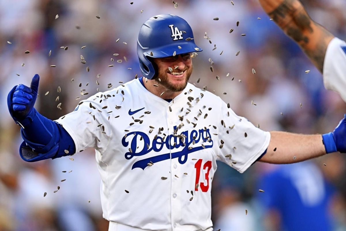Aug 5, 2025; Los Angeles, California, USA; Los Angeles Dodgers third baseman Max Muncy (13) celebrates after hitting a home run during the first inning against the St. Louis Cardinals at Dodger Stadium. Mandatory Credit: William Liang-Imagn Images
