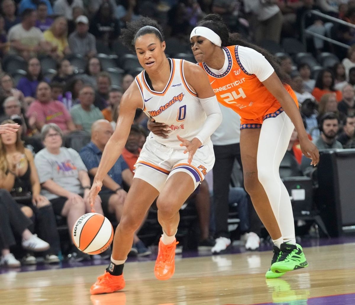 Phoenix Mercury forward Satou Sabally (0) is fouled by Connecticut Sun forward Aneesah Morrow (24) during the first quarter at PHX Arena on Aug. 5, 2025, in Phoenix.