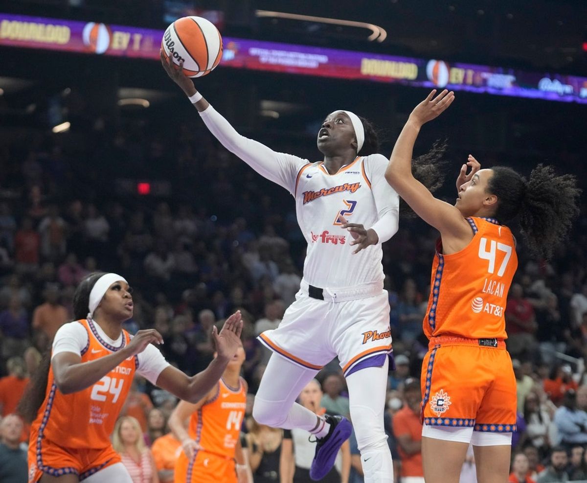 Phoenix Mercury guard Kahleah Copper (2) lays the ball in past Connecticut Sun guard Leila Lacan (47) during the first quarter at PHX Arena on Aug. 5, 2025, in Phoenix.