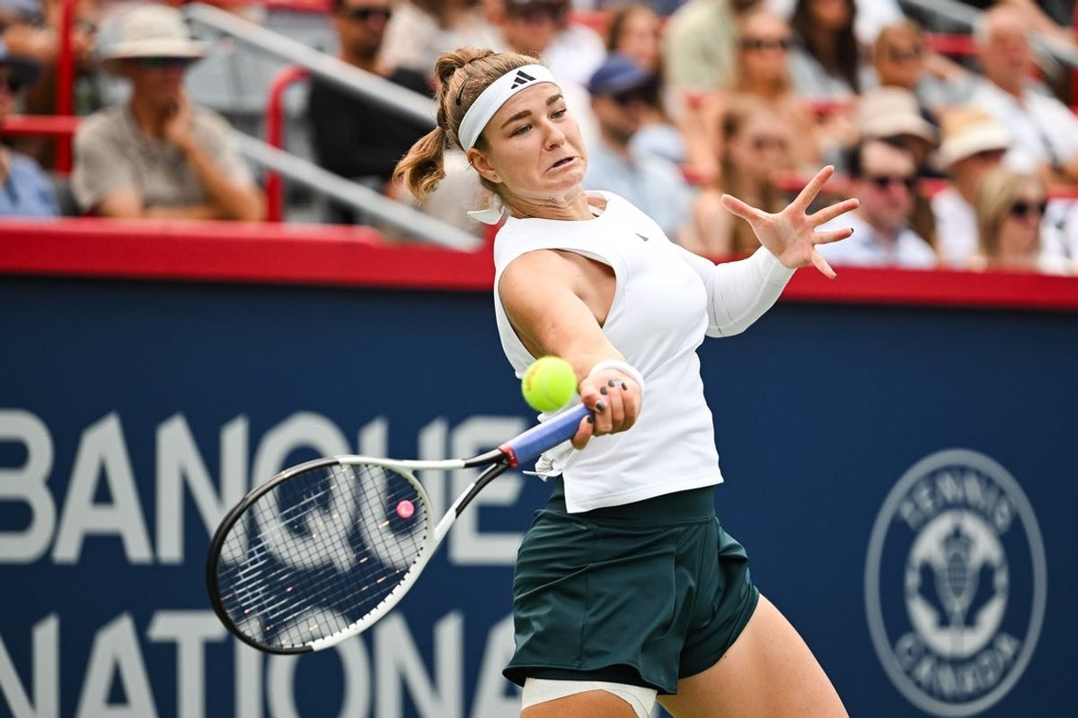 Aug 3, 2025; Montreal, QC, Canada; Karolina Muchova (CZE) returns the ball to Madison Keys (USA) in fourth round play at IGA Stadium. Mandatory Credit: David Kirouac-Imagn Images