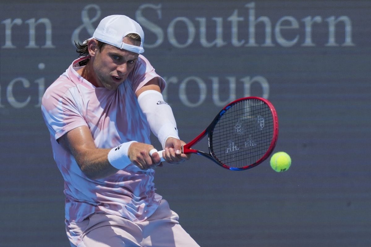 Aug 7, 2025; Cincinnati, OH, USA; Zizou Bergs (BEL) returns a shot against Jacob Fearnley (GBR) during the Cincinnati Open at the Lindner Family Tennis Center. Mandatory Credit: Aaron Doster-Imagn Images