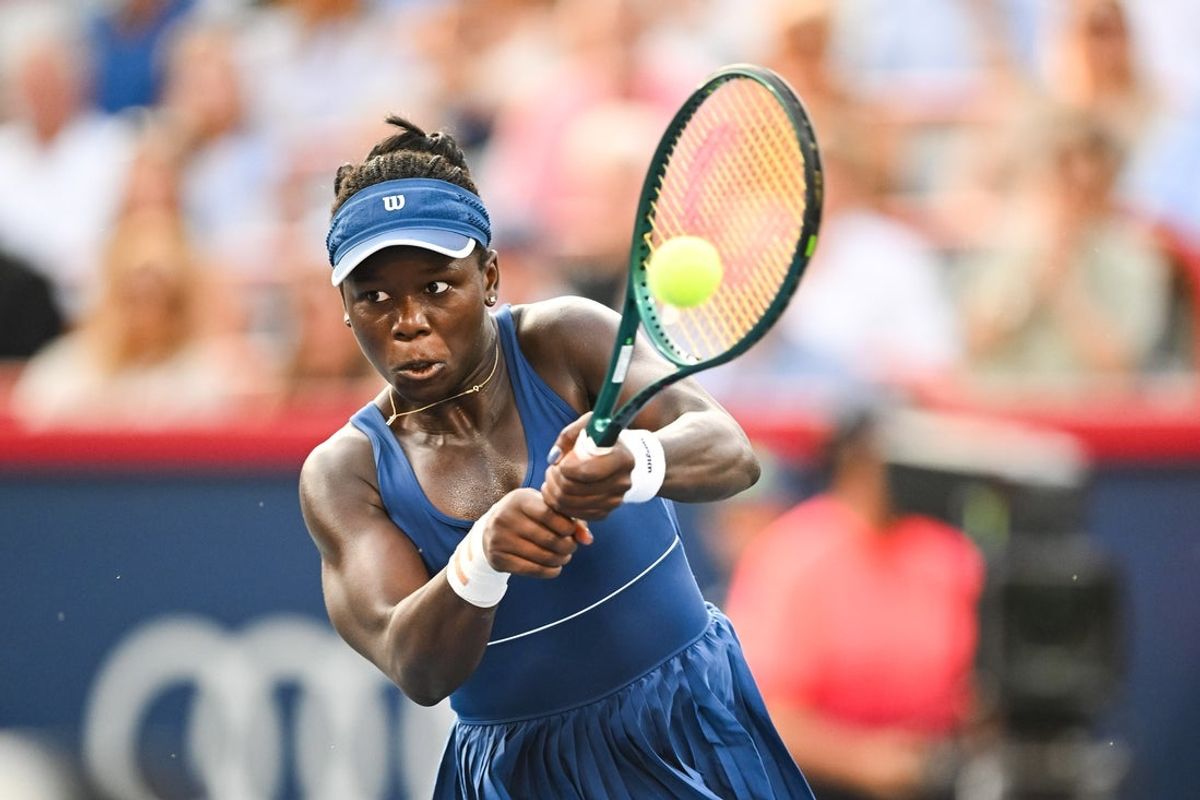 Aug 7, 2025; Montreal, QC, Canada; Victoria Mboko (CAN) returns the ball to Naomi Osaka (JPN) during singles final play at IGA Stadium. Mandatory Credit: David Kirouac-Imagn Images