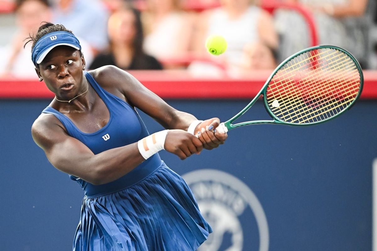 Aug 7, 2025; Montreal, QC, Canada; Victoria Mboko (CAN) returns the ball to Naomi Osaka (JPN) during singles final play at IGA Stadium. Mandatory Credit: David Kirouac-Imagn Images