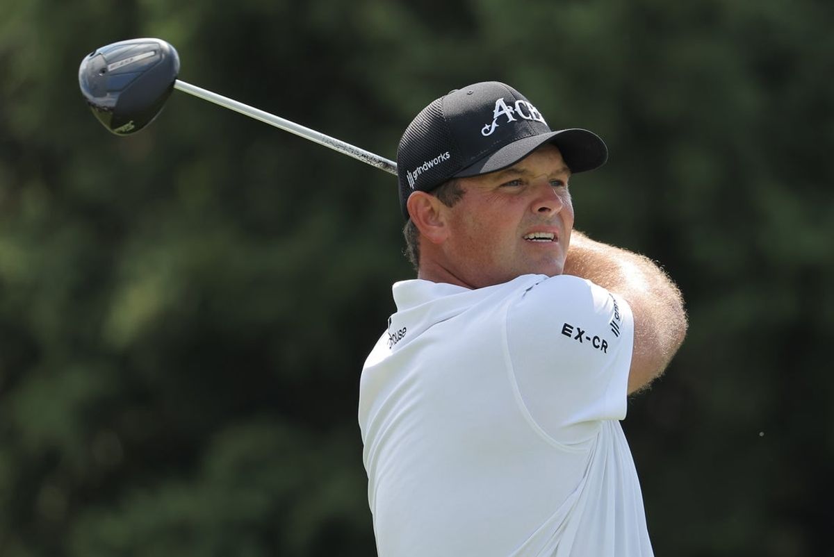 AUG 08, 2025; Bolingbrook, Illinois, USA; Patrick Reed of the 4Aces GC watches his shot on the on 14th hole during the first round of the LIV Golf Chicago tournament at Bolingbrook Golf Club. Mandatory Credit: Melissa Tamez-Imagn Images