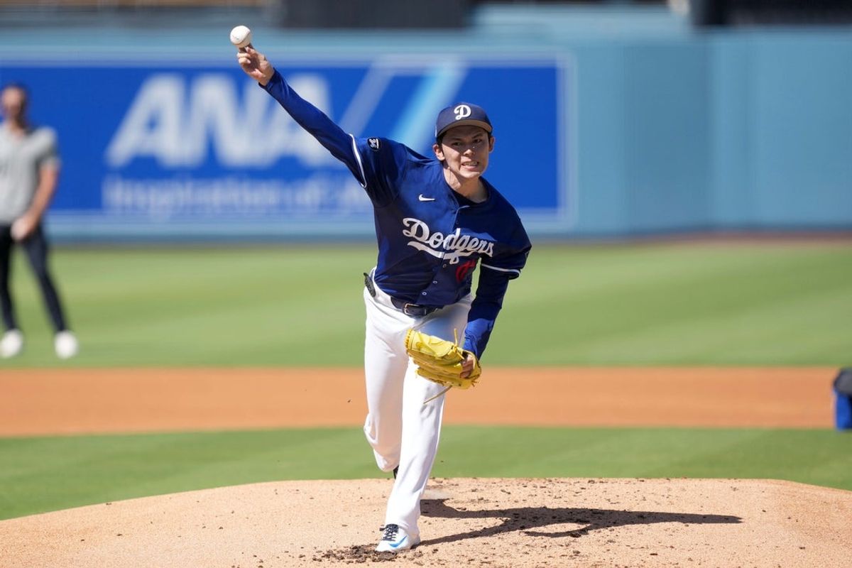 Aug 8, 2025; Los Angeles, California, USA; Los Angeles Dodgers pitcher Roki Sasaki (11) throws before the game against the Toronto Blue Jays at Dodger Stadium. Mandatory Credit: Kirby Lee-Imagn Images