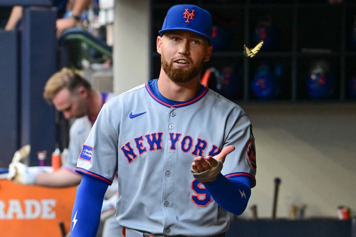 Aug 8, 2025; Milwaukee, Wisconsin, USA; New York Mets left fielder Brandon Nimmo (9) chases a butterfly in the dugout during game against the Milwaukee Brewers at American Family Field. Mandatory Credit: Benny Sieu-Imagn Images