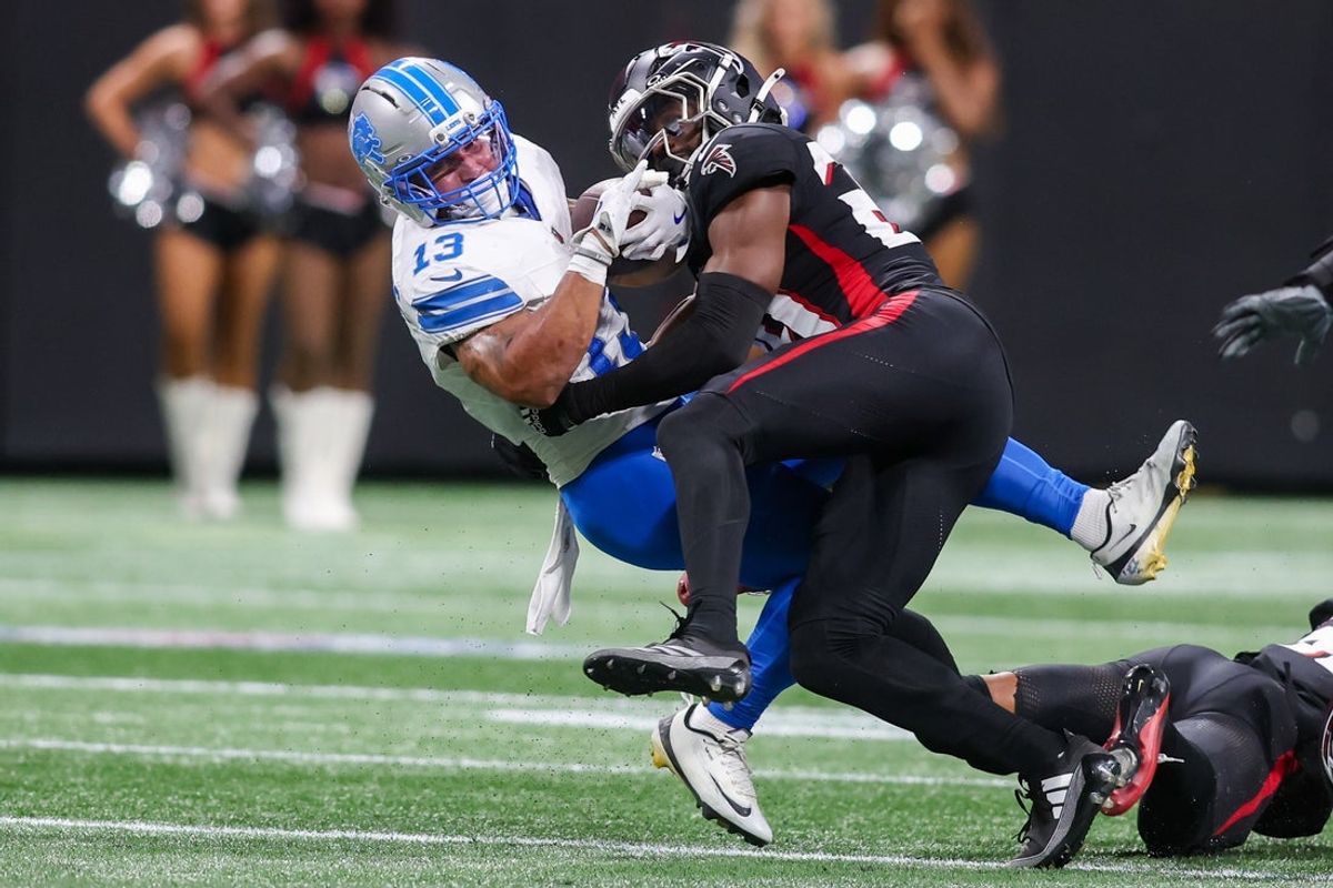 Aug 8, 2025; Atlanta, Georgia, USA; Detroit Lions running back Craig Reynolds (13) is tackled by Atlanta Falcons safety Jordan Fuller (29) in the first quarter at Mercedes-Benz Stadium. Mandatory Credit: Brett Davis-Imagn Images
