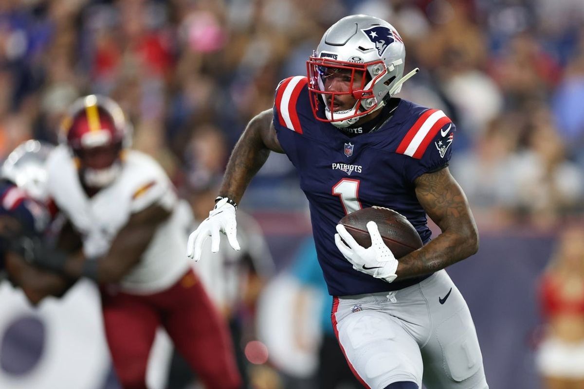 Aug 8, 2025; Foxborough, Massachusetts, USA; New England Patriots receiver Ja'Lynn Polk (1) runs the ball during the first half against the Washington Commanders at Gillette Stadium. Mandatory Credit: Paul Rutherford-Imagn Images