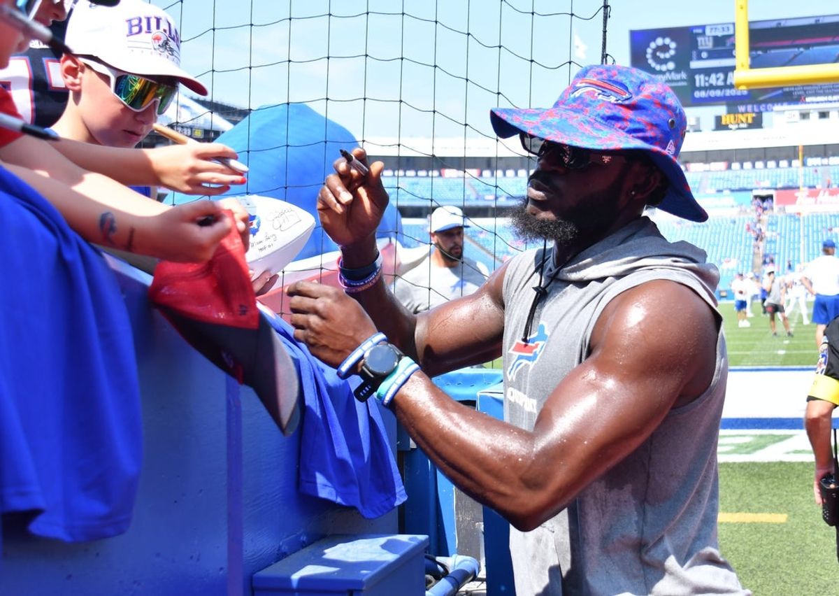 Aug 9, 2025; Orchard Park, New York, USA; Buffalo Bills cornerback Tre'Davious White (27) signs autographs before a game against the New York Giants at Highmark Stadium. Mandatory Credit: Mark Konezny-Imagn Images