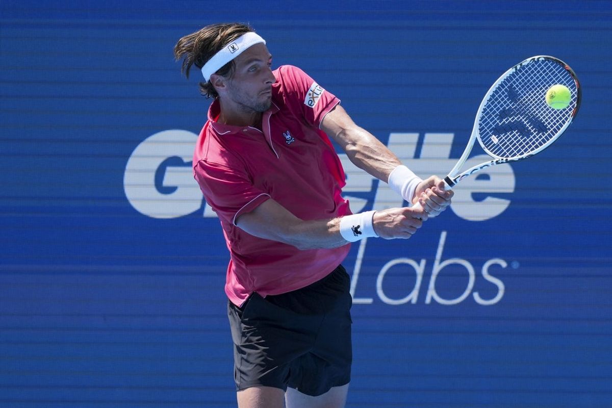 Aug 9, 2025; Cincinnati, OH, USA; Arthur Rinderknech (FRA) returns a shot against Casper Ruud (NOR) during the Cincinnati Open at the Lindner Family Tennis Center. Mandatory Credit: Aaron Doster-Imagn Images