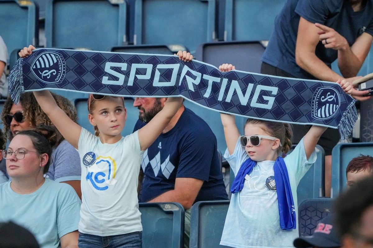 Aug 9, 2025; Kansas City, Kansas, USA; Young Sporting Kansas City fans show support against San DIego FC prior to a math  at Children's Mercy Park. Mandatory Credit: Denny Medley-Imagn Images