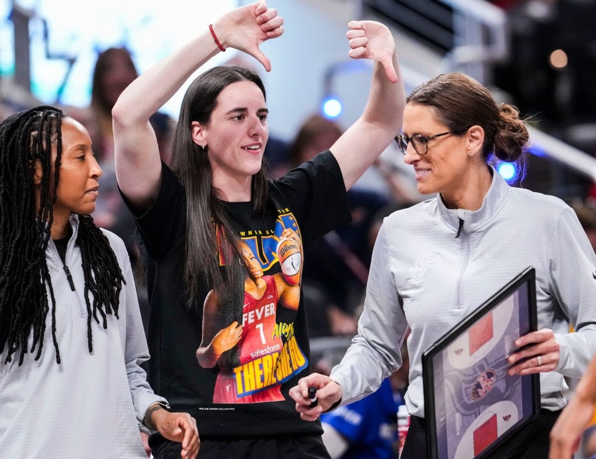 Indiana Fever guard Caitlin Clark (22) jokes with Indiana Fever head coach Stephanie White on Saturday, Aug. 9, 2025, during a game between the Indiana Fever and the Chicago Sky at Gainbridge Fieldhouse in Indianapolis.