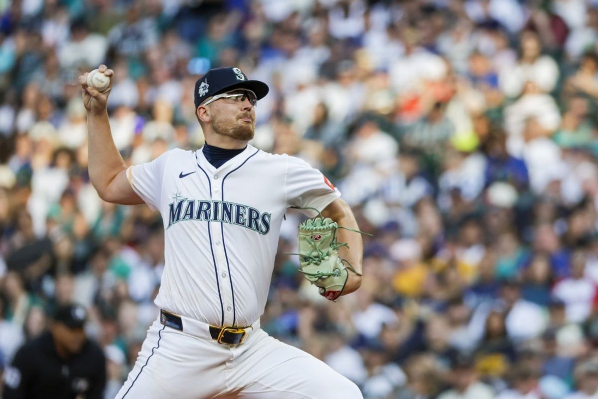 Aug 9, 2025; Seattle, Washington, USA; Seattle Mariners starting pitcher Logan Evans (73) throws against the Tampa Bay Rays during the first inning at T-Mobile Park. Mandatory Credit: Joe Nicholson-Imagn Images