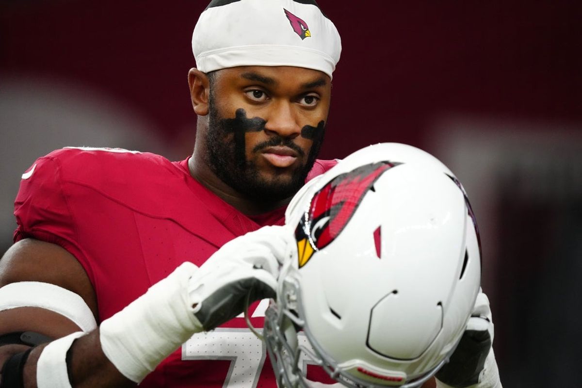Cardinals offensive lineman Paris Johnson Jr. (70) warms up during a preseason game at State Farm Stadium on Aug. 9, 2025, in Glendale.