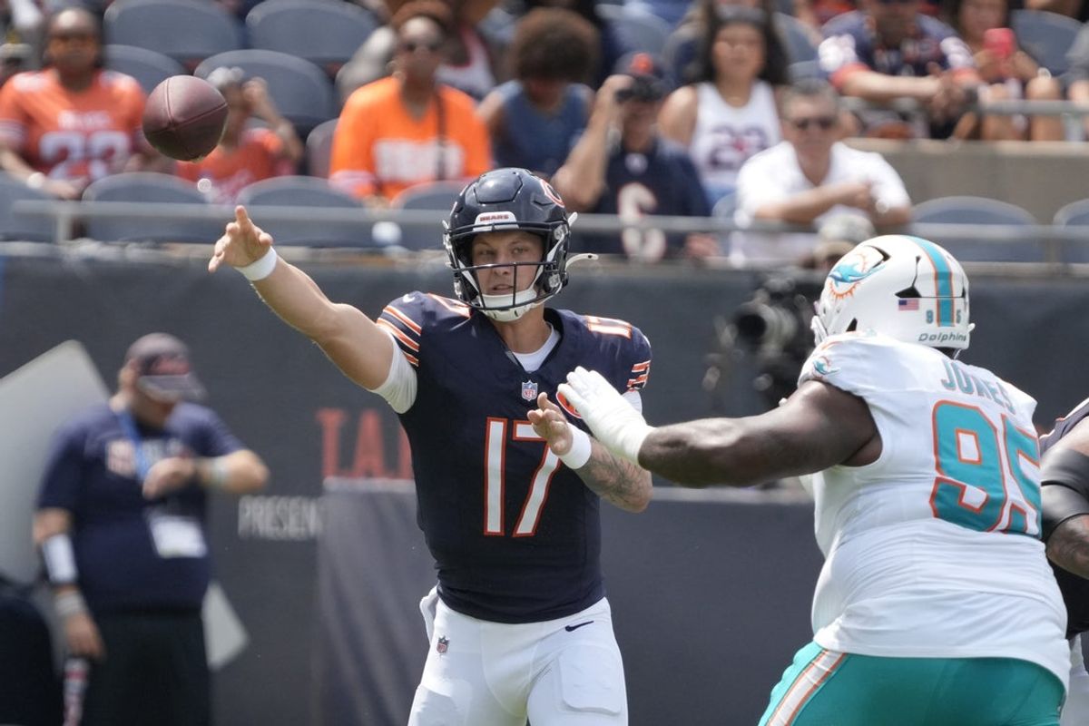 Aug 10, 2025; Chicago, Illinois, USA; Chicago Bears quarterback Tyson Bagent (17) passes the ball around Miami Dolphins defensive tackle Benito Jones (95) during the first half at Soldier Field. Mandatory Credit: David Banks-Imagn Images