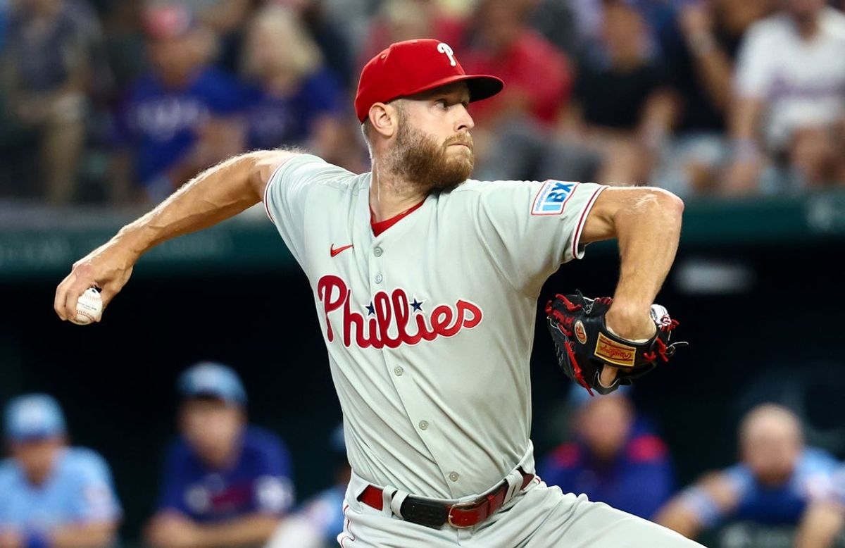 Aug 10, 2025; Arlington, Texas, USA;  Philadelphia Phillies starting pitcher Zack Wheeler (45) throws during the first inning against the Texas Rangers at Globe Life Field. Mandatory Credit: Kevin Jairaj-Imagn Images