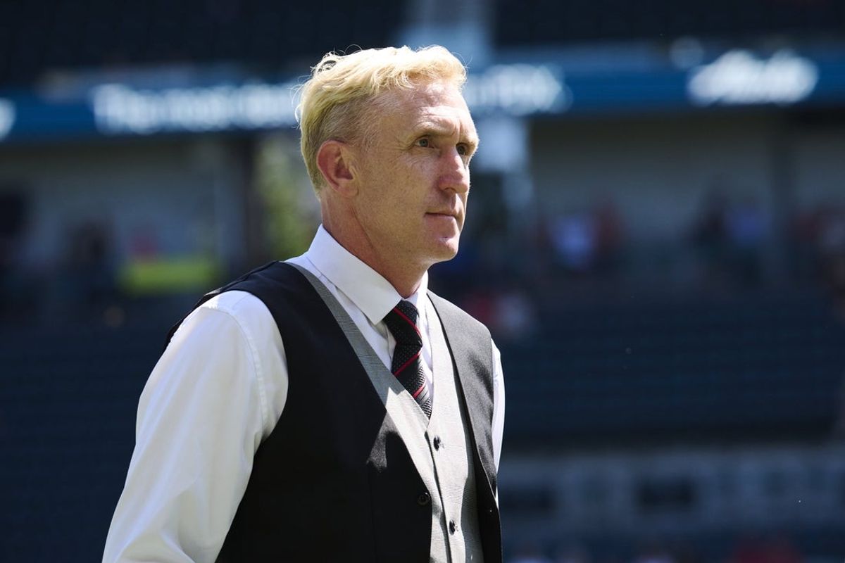 Aug 10, 2025; Portland, Oregon, USA; Portland Thorns FC head coach Rob Gale watches players warm up before a game against Seattle Reign at Providence Park. Mandatory Credit: Troy Wayrynen-Imagn Images
