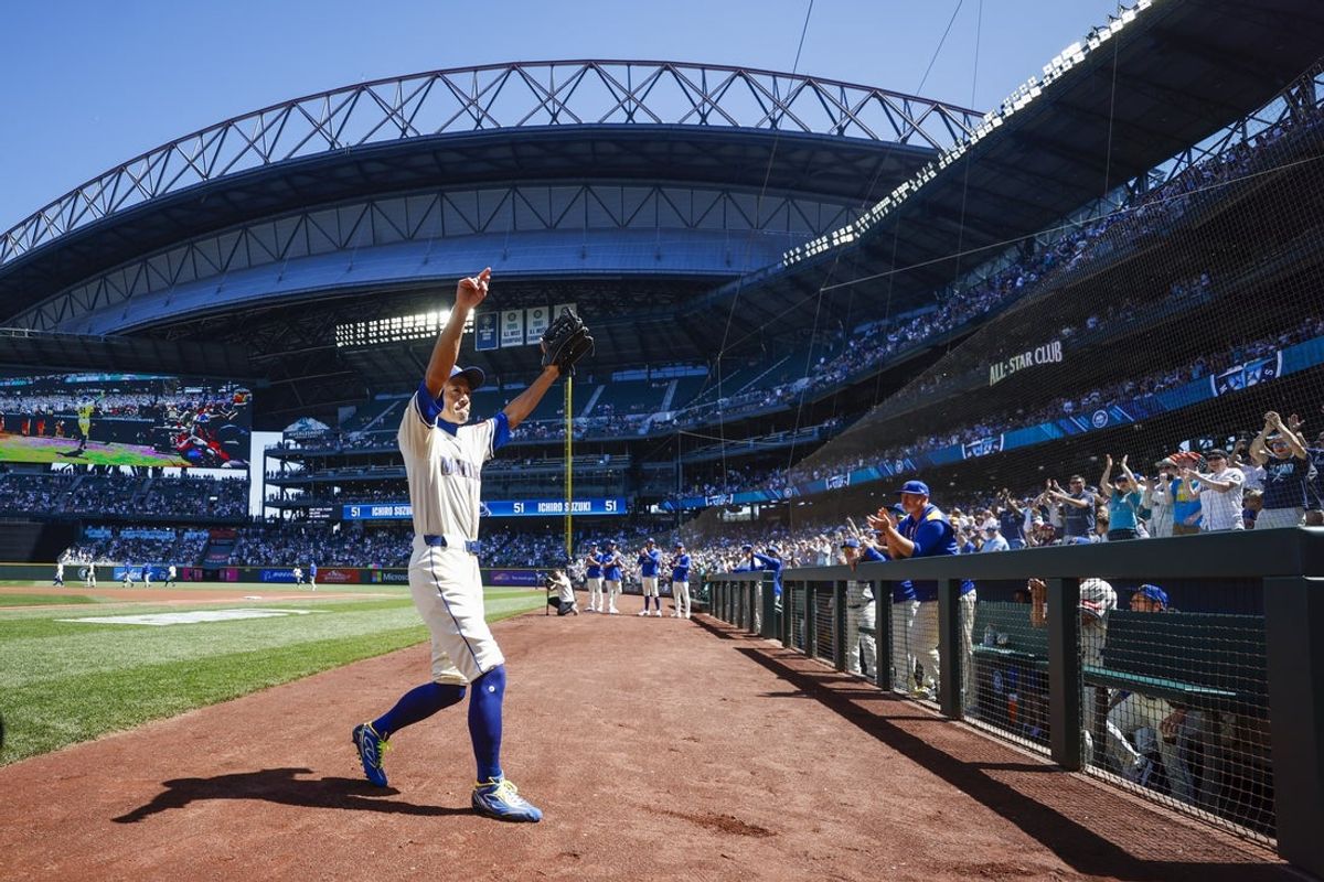Seattle Mariners former outfielder Ichiro Suzuki (51) exits the dugout to throw out the ceremonial first pitch before a game against the Tampa Bay Rays at T-Mobile Park. Mandatory Credit: Joe Nicholson-Imagn Images