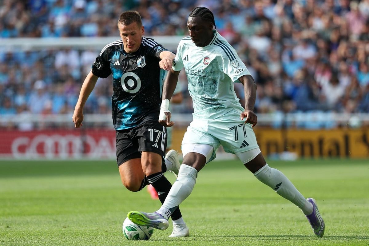 Aug 10, 2025; Saint Paul, Minnesota, USA; Colorado Rapids forward Darren Yapi (77) and Minnesota United midfielder Robin Lod (17) compete for the ball during the first half at Allianz Field. Mandatory Credit: Matt Krohn-Imagn Images