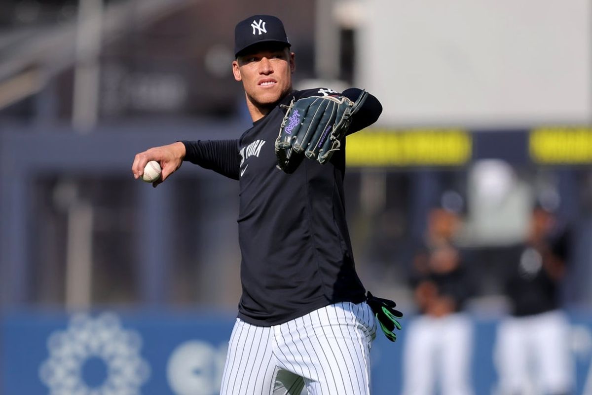 New York Yankees designated hitter Aaron Judge (99) throws a ball in the outfield before a game against the Minnesota Twins at Yankee Stadium. Mandatory Credit: Brad Penner-Imagn Images