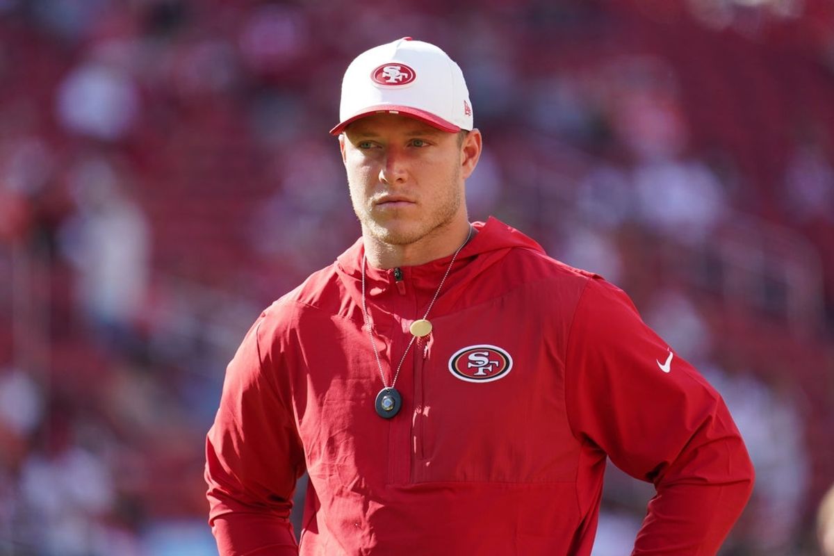 Aug 9, 2025; Santa Clara, California, USA;  San Francisco 49ers running back Christian McCaffrey (23) watches warm ups before the game against the Denver Broncos at Levi's Stadium. Mandatory Credit: David Gonzales-Imagn Images