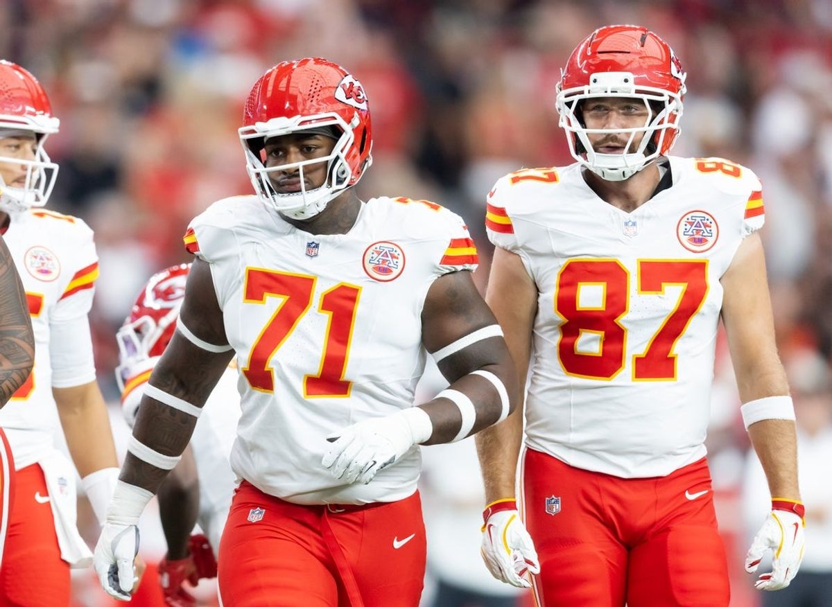Aug 9, 2025; Glendale, Arizona, USA; Kansas City Chiefs offensive tackle Josh Simmons (71) and tight end Travis Kelce (87) against the Arizona Cardinals during a preseason NFL game at State Farm Stadium. Mandatory Credit: Mark J. Rebilas-Imagn Images