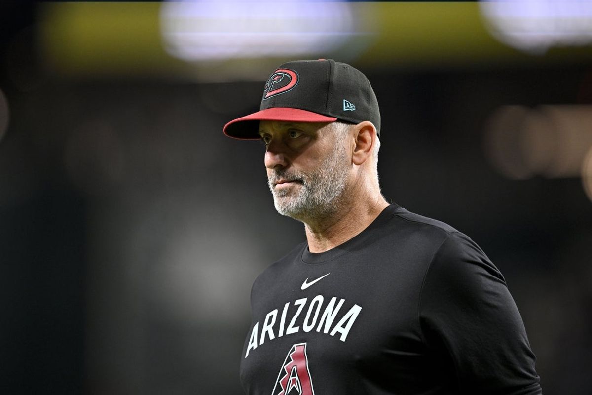 Aug 11, 2025; Arlington, Texas, USA; Arizona Diamondbacks manager Torey Lovullo (17) walks back to the dugout during the sixth inning against the Texas Rangers at Globe Life Field. Mandatory Credit: Jerome Miron-Imagn Images