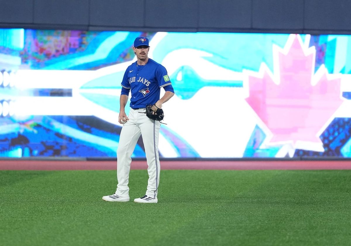 Aug 12, 2025; Toronto, Ontario, CAN; Toronto Blue Jays pitcher Shane Bieber (57) takes a break during batting practice before a game against the Chicago Cubs at Rogers Centre. Mandatory Credit: Nick Turchiaro-Imagn Images