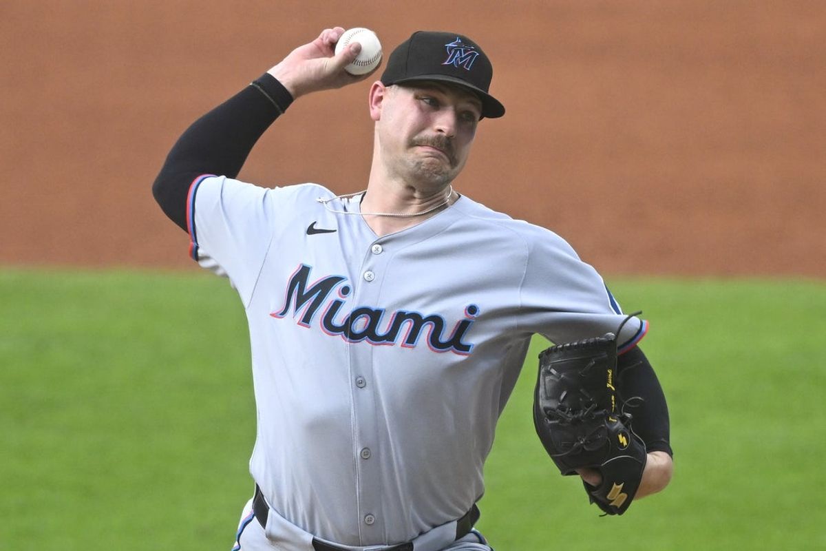 Aug 12, 2025; Cleveland, Ohio, USA; Miami Marlins starting pitcher Janson Junk (26) delivers a pitch in the second inning against the Cleveland Guardians at Progressive Field. Mandatory Credit: David Richard-Imagn Images