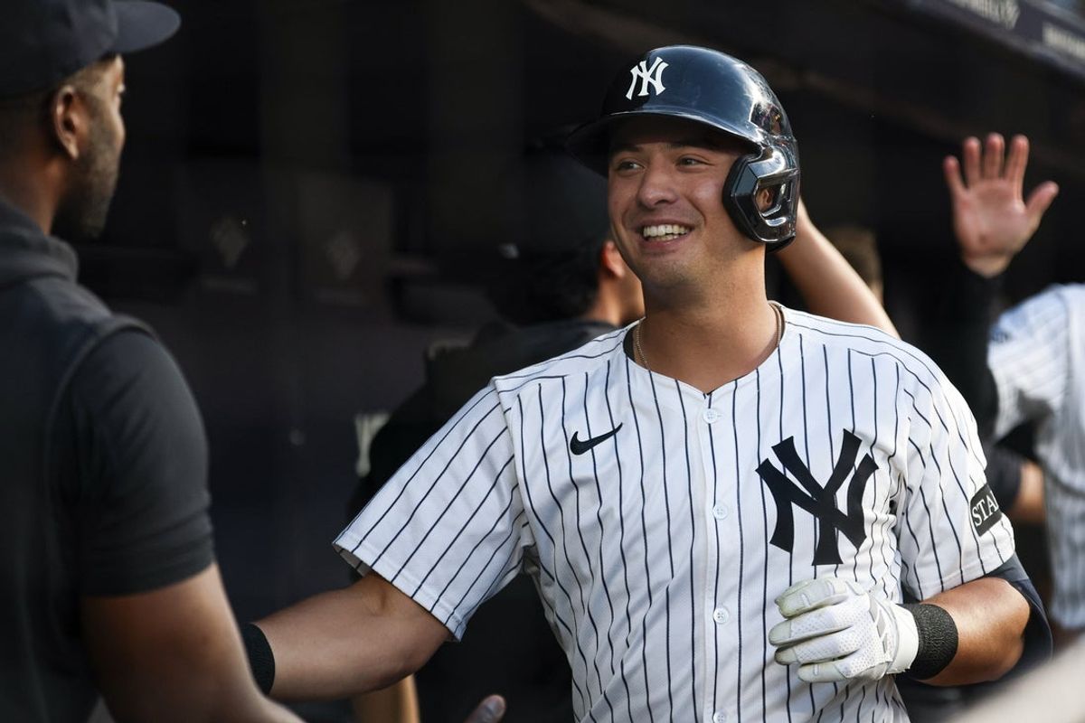 Aug 12, 2025; Bronx, New York, USA; New York Yankees shortstop Anthony Volpe (11) celebrates with teammates after hitting a three run home run during the second inning against the Minnesota Twins  at Yankee Stadium. Mandatory Credit: Vincent Carchietta-Imagn Images