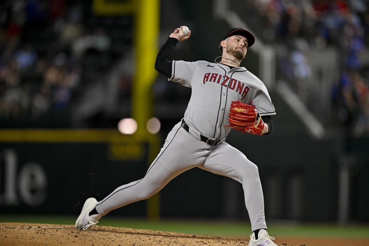 Aug 11, 2025; Arlington, Texas, USA; Arizona Diamondbacks starting pitcher Ryne Nelson (19) pitches during the game between the Texas Rangers and the Arizona Diamondbacks at Globe Life Field. Mandatory Credit: Jerome Miron-Imagn Images