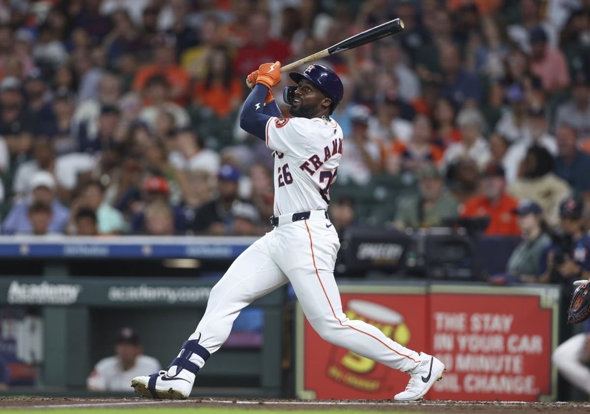 Aug 12, 2025; Houston, Texas, USA; Houston Astros left fielder Taylor Trammell (26) bats during the game against the Boston Red Sox at Daikin Park. Mandatory Credit: Troy Taormina-Imagn Images