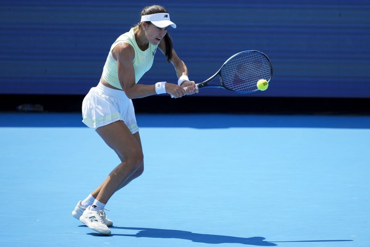 Aug 13, 2025; Cincinnati, OH, USA;  Sorana Cirstea (ROU) returns a shot against Iga Swiatek (POL) during the Cincinnati Open at the Lindner Family Tennis Center. Mandatory Credit: Aaron Doster-Imagn Images