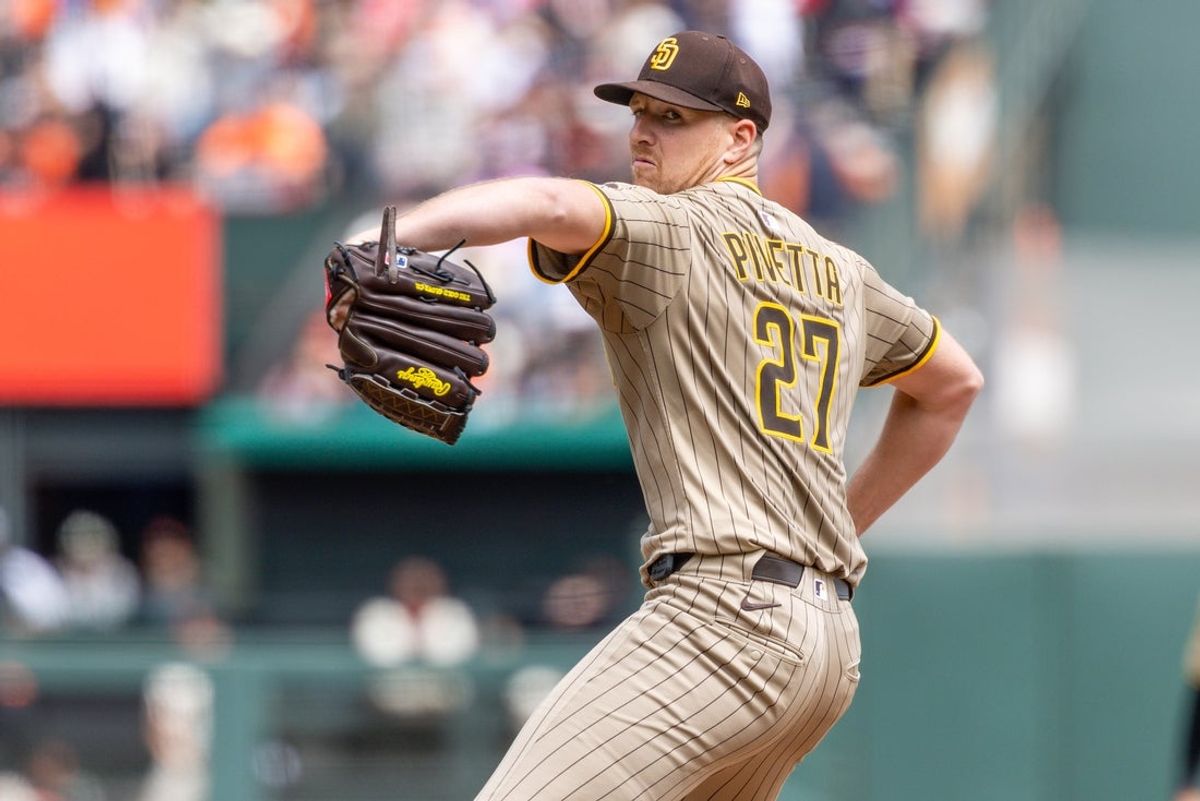 Aug 13, 2025; San Francisco, California, USA; San Diego Padres pitcher Nick Pivetta (27) throws a pitch during the fifth inning against the San Francisco Giants at Oracle Park. Mandatory Credit: Bob Kupbens-Imagn Images