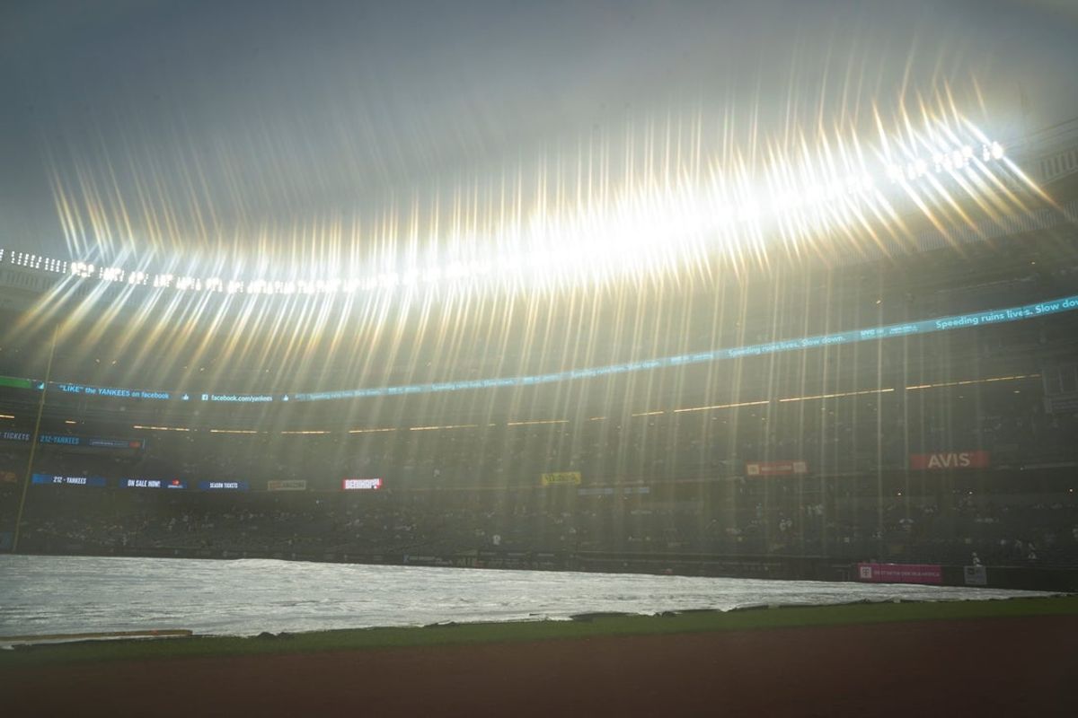 Rain tarps cover the field before a game between the New York Yankees and the Minnesota Twins at Yankee Stadium, Aug 13, 2025, Bronx, New York, USA. Yannick Peterhans/NorthJersey.com