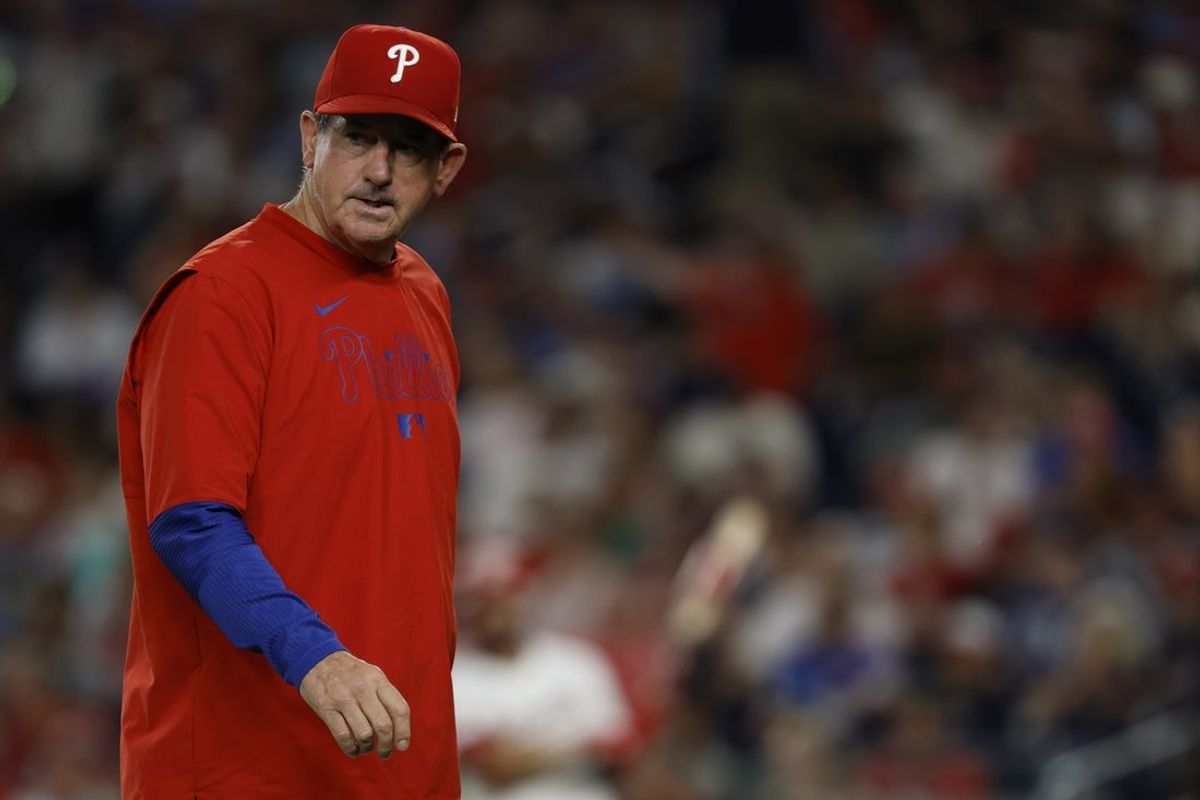 Aug 14, 2025; Washington, District of Columbia, USA; Philadelphia Phillies manager Rob Thomson walks back to the dugout after making a pitching change against the Washington Nationals during the seventh inning at Nationals Park. Mandatory Credit: Geoff Burke-Imagn Images