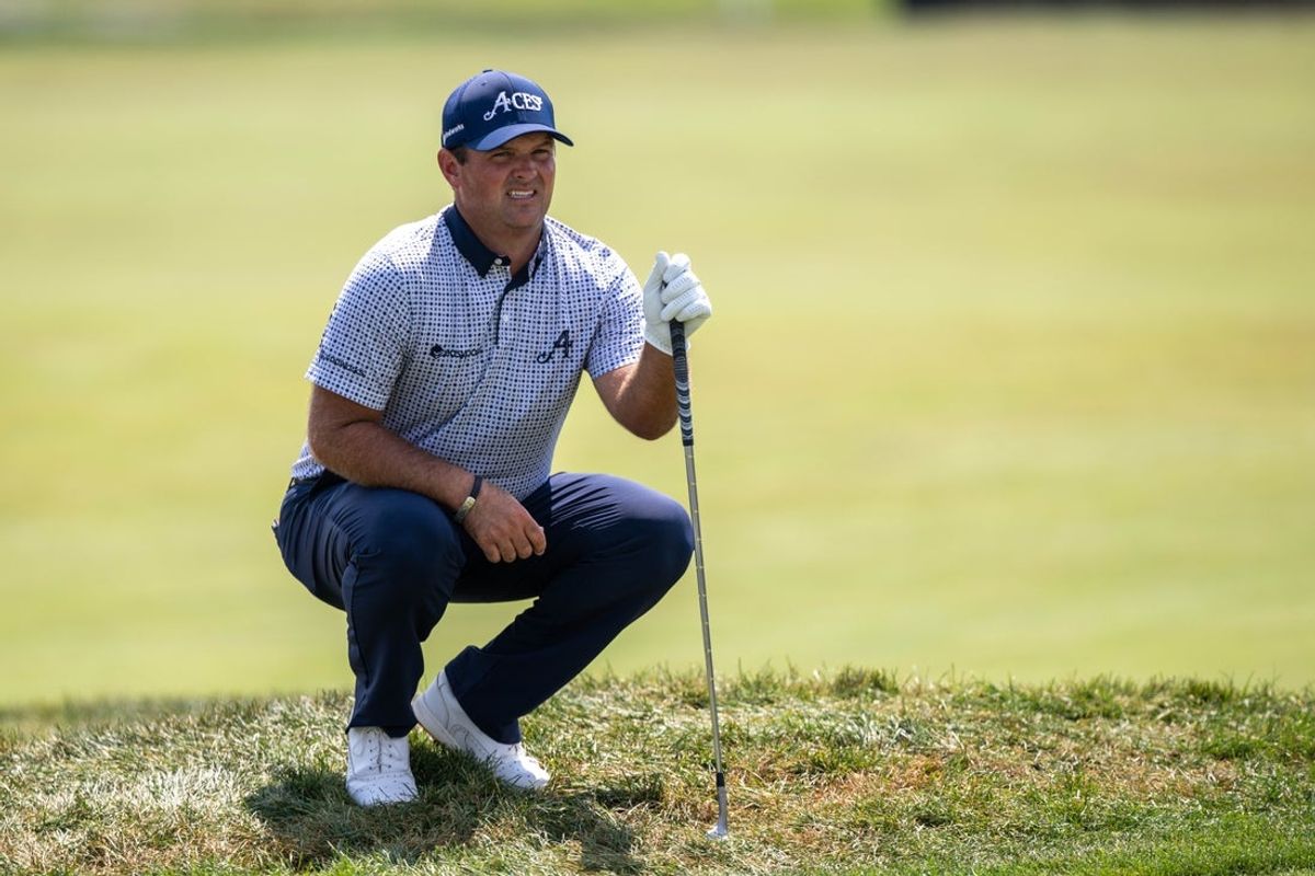 Aug 15, 2025; Indianapolis, IN, United States; Patrick Reed of 4 Aces GC looks at a line on the 5th hole during the first round of LIV Golf Indianapolis. Mandatory Credit: Marc Lebryk-Imagn Images