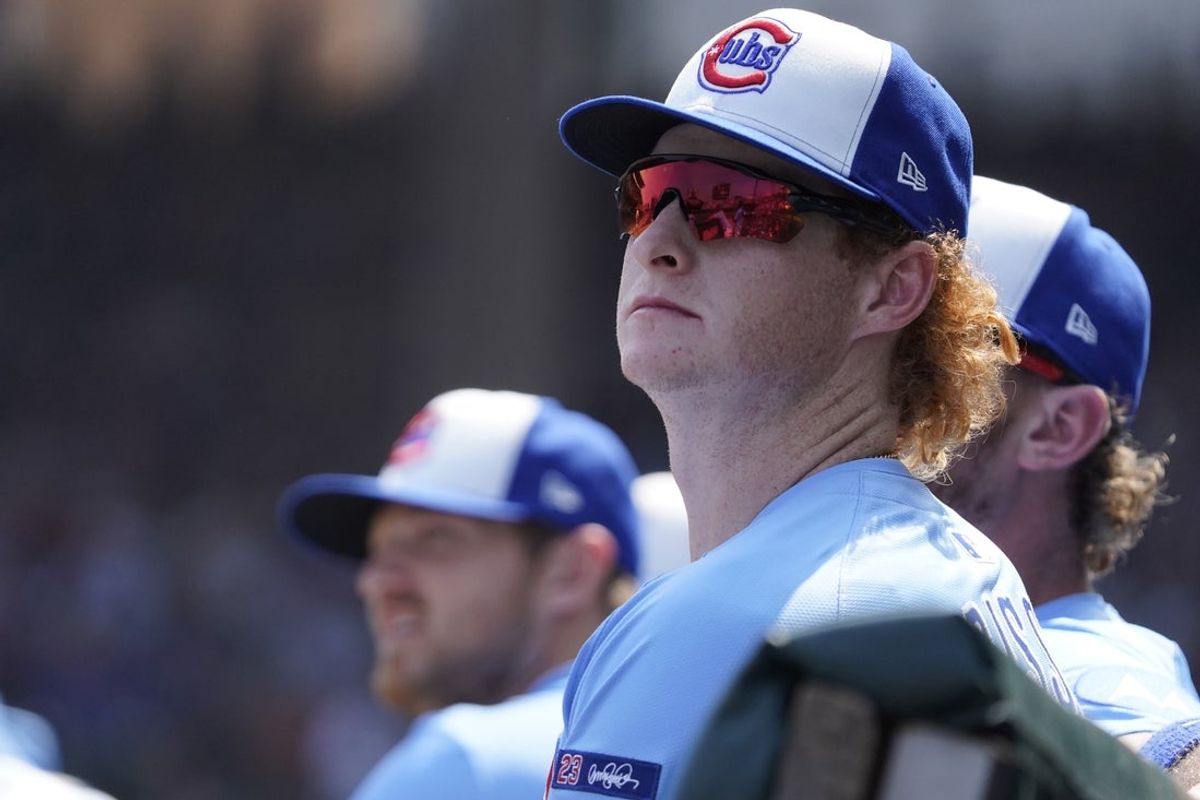 Aug 15, 2025; Chicago, Illinois, USA; Chicago Cubs rookie outfielder Owen Caissie (19) watches the game against the Pittsburgh Pirates during the third inning at Wrigley Field. Mandatory Credit: David Banks-Imagn Images