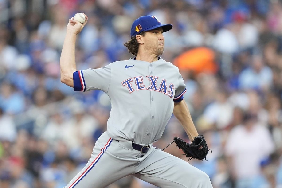 Aug 15, 2025; Toronto, Ontario, CAN; Texas Rangers starting pitcher Jacob deGrom (48) pitches to the Toronto Blue Jays during the first inning at Rogers Centre. Mandatory Credit: John E. Sokolowski-Imagn Images