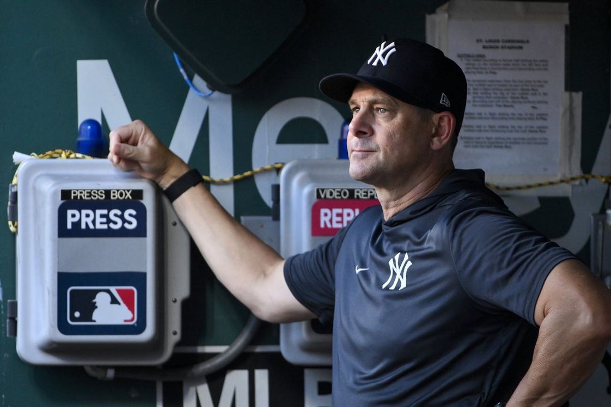 Aug 15, 2025; St. Louis, Missouri, USA;  New York Yankees manager Aaron Boone (17) looks on from the dugout before a game against the St. Louis Cardinals at Busch Stadium. Mandatory Credit: Jeff Curry-Imagn Images