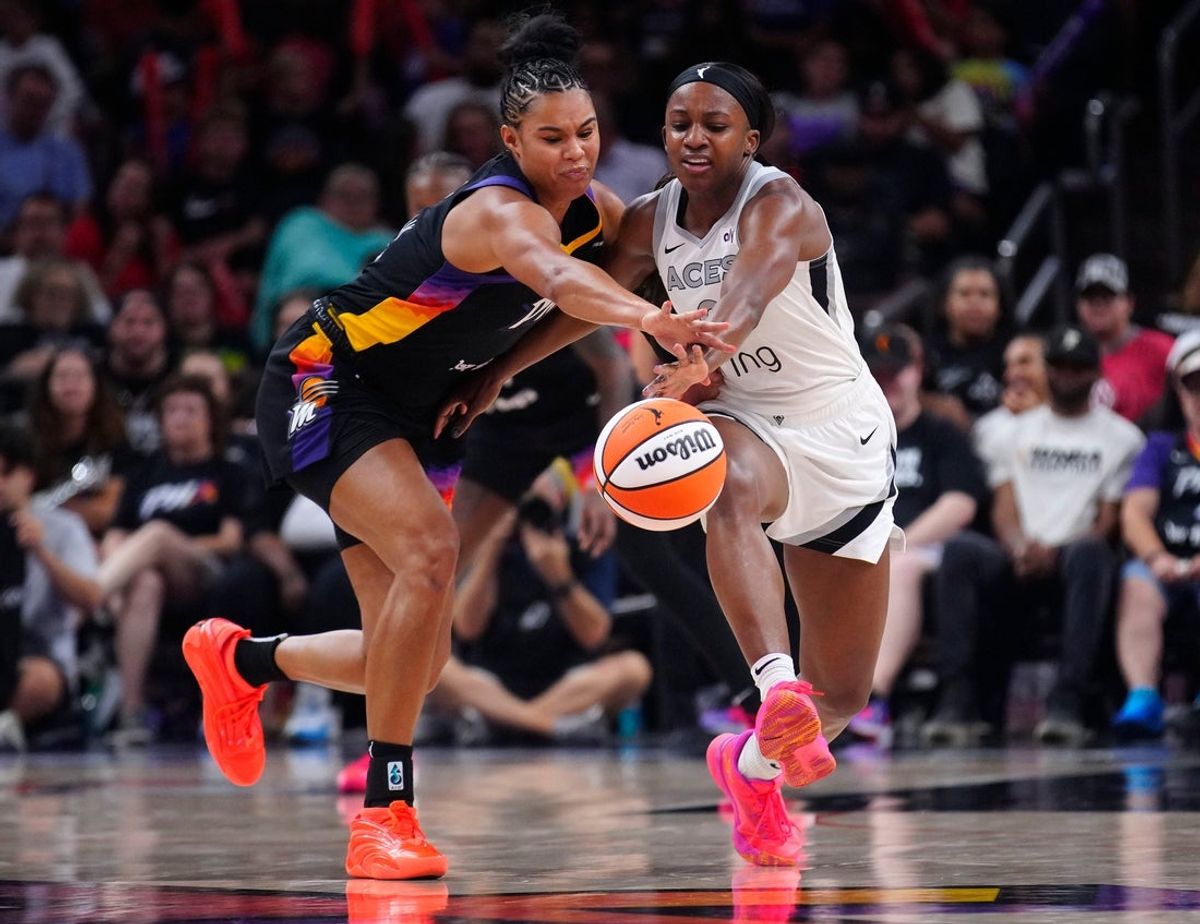 Mercury forward Satou Sabally (L) and Aces guard Jackie Young (0) go for a loose ball during a game at PHX Arena in Phoenix, on Aug. 15, 2025.