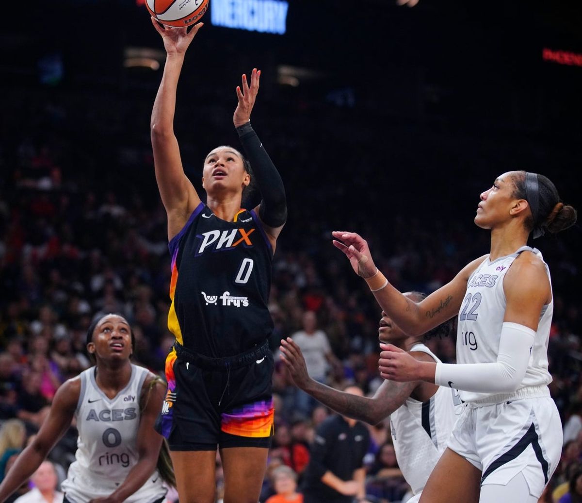 Mercury forward Satou Sabally (0) scores on an offensive rebound against Aces forward A’ja Wilson (22) during a game at PHX Arena in Phoenix, on Aug. 15, 2025.