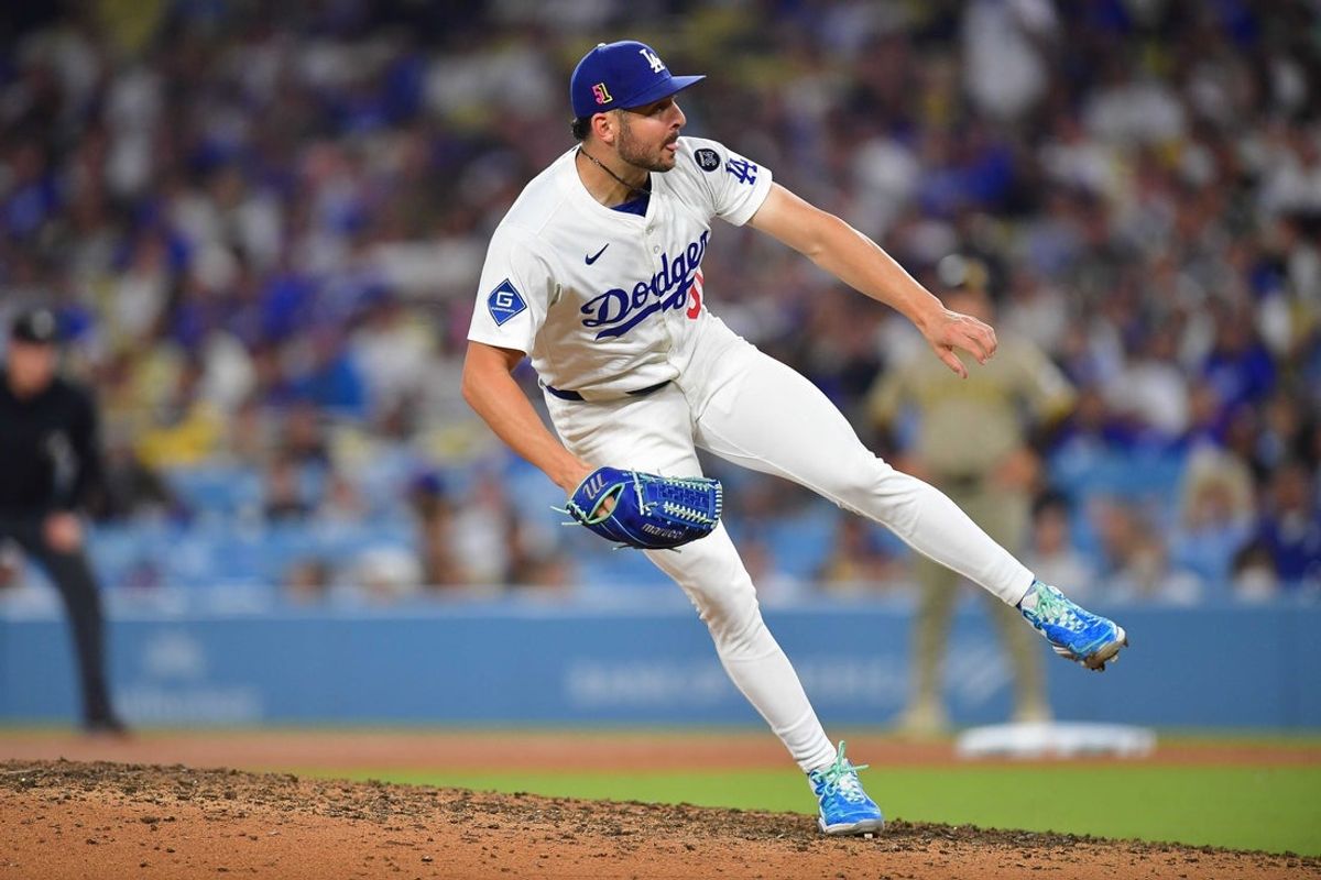 Aug 15, 2025; Los Angeles, California, USA; Los Angeles Dodgers pitcher Alex Vesia (51) throws against the San Diego Padres during the eighth inning at Dodger Stadium. Mandatory Credit: Gary A. Vasquez-Imagn Images