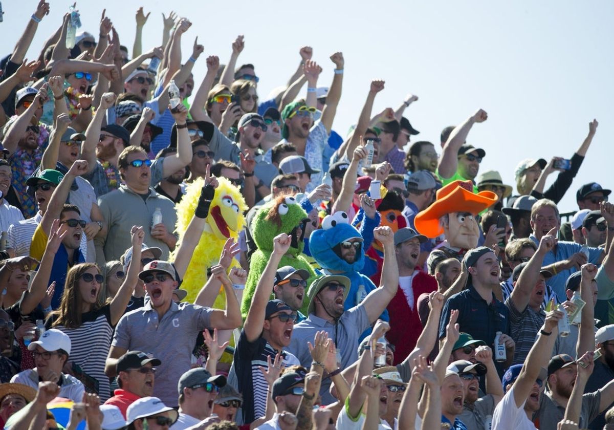 Golf fans cheers on the 16th hole during the third round of the Waste Management Phoenix Open at TPC Scottsdale on February 3, 2018.