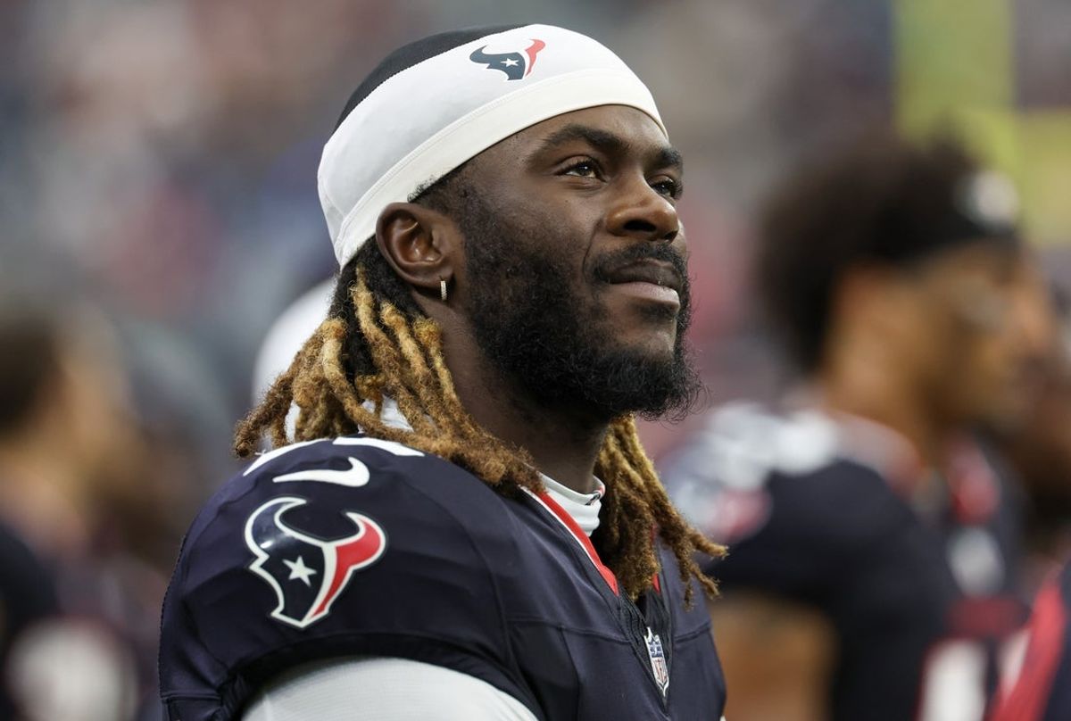 Aug 16, 2025; Houston, Texas, USA; Houston Texans defensive end Darrell Taylor (52) watches the Carolina Panthers play against the Texans in the second half at NRG Stadium. Mandatory Credit: Thomas Shea-Imagn Images