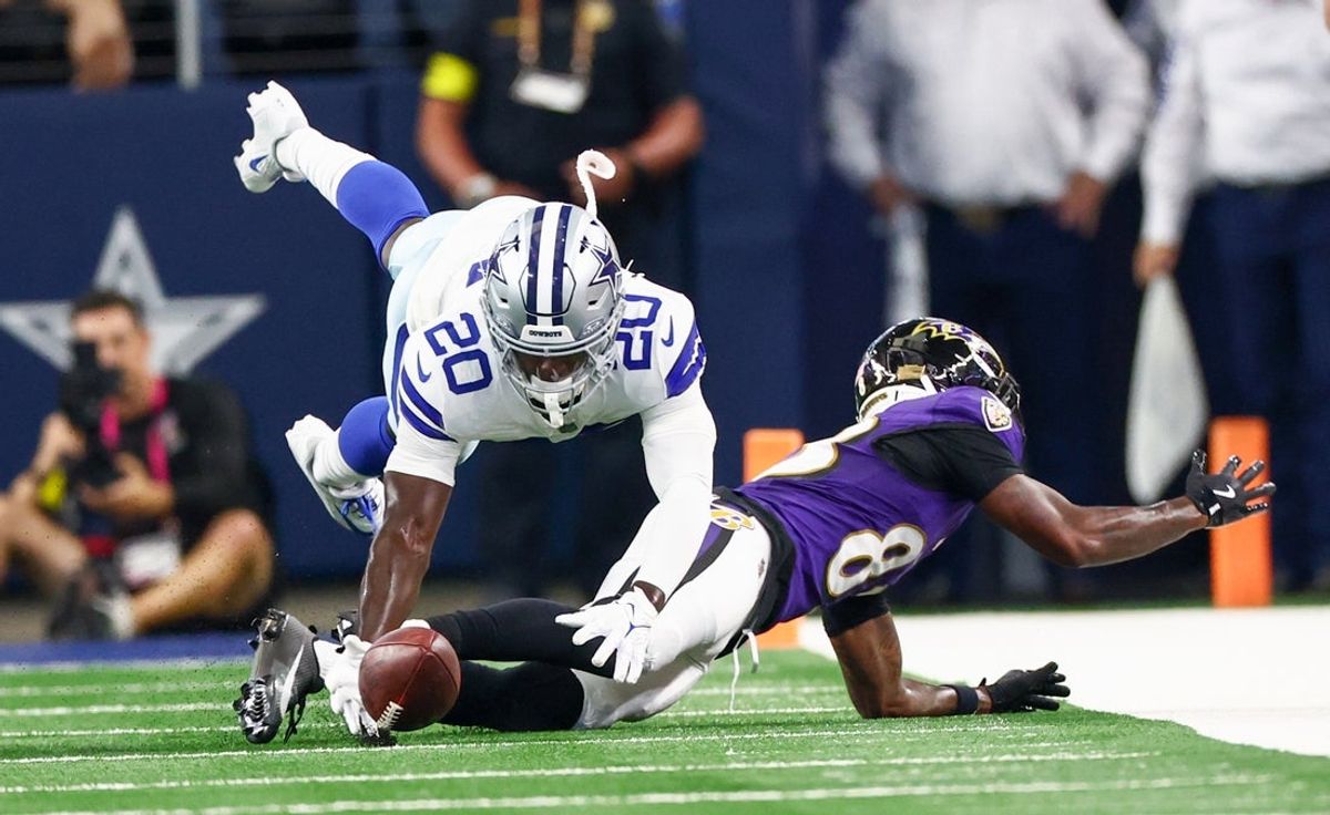Aug 16, 2025; Arlington, Texas, USA;  Baltimore Ravens wide receiver LaJohntay Wester (83) and Dallas Cowboys cornerback Kaiir Elam (20) go for the ball during the first quarter at AT&T Stadium. Mandatory Credit: Kevin Jairaj-Imagn Images