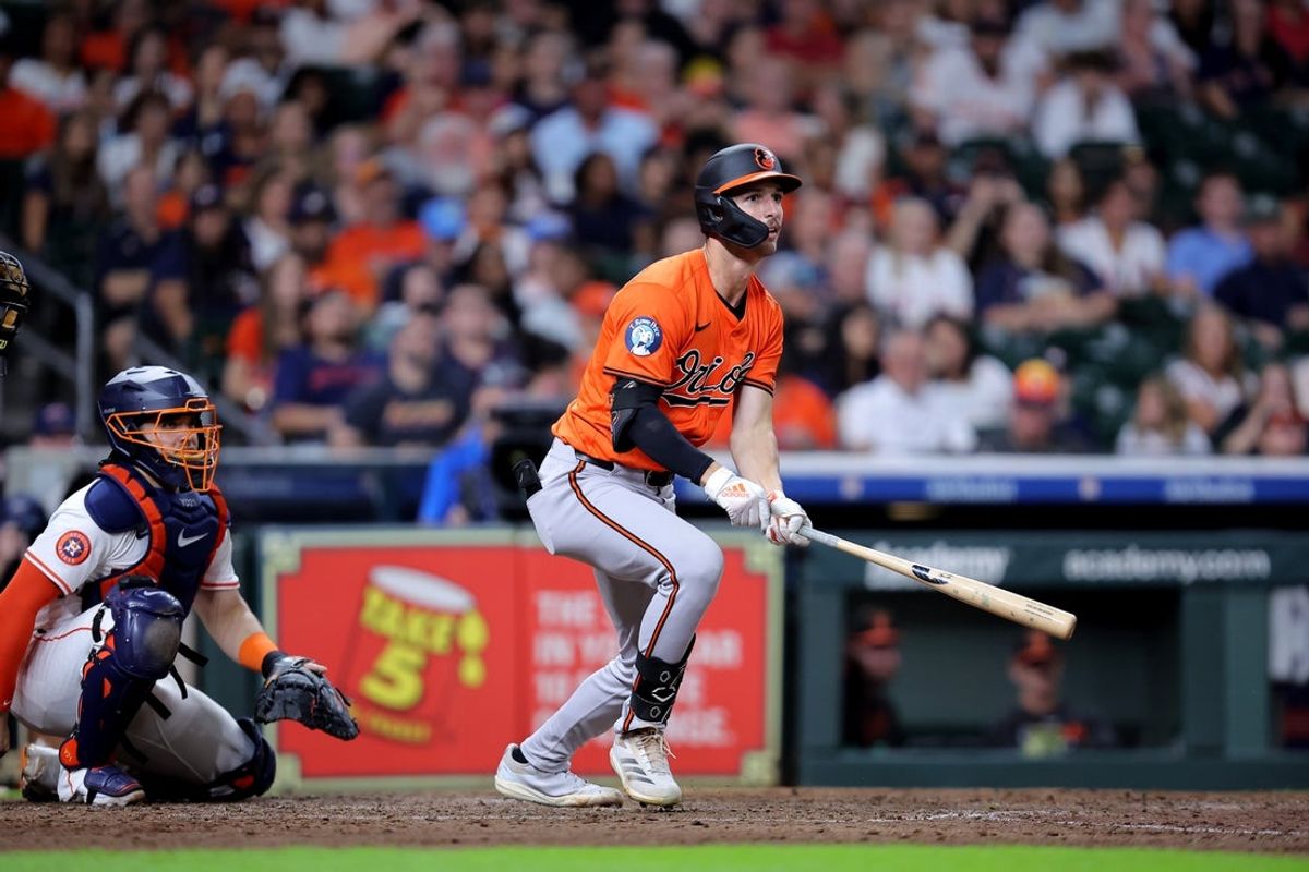 Aug 16, 2025; Houston, Texas, USA; Baltimore Orioles right fielder Dylan Beavers (12) hits a double against the Houston Astros during the ninth inning at Daikin Park. Mandatory Credit: Erik Williams-Imagn Images