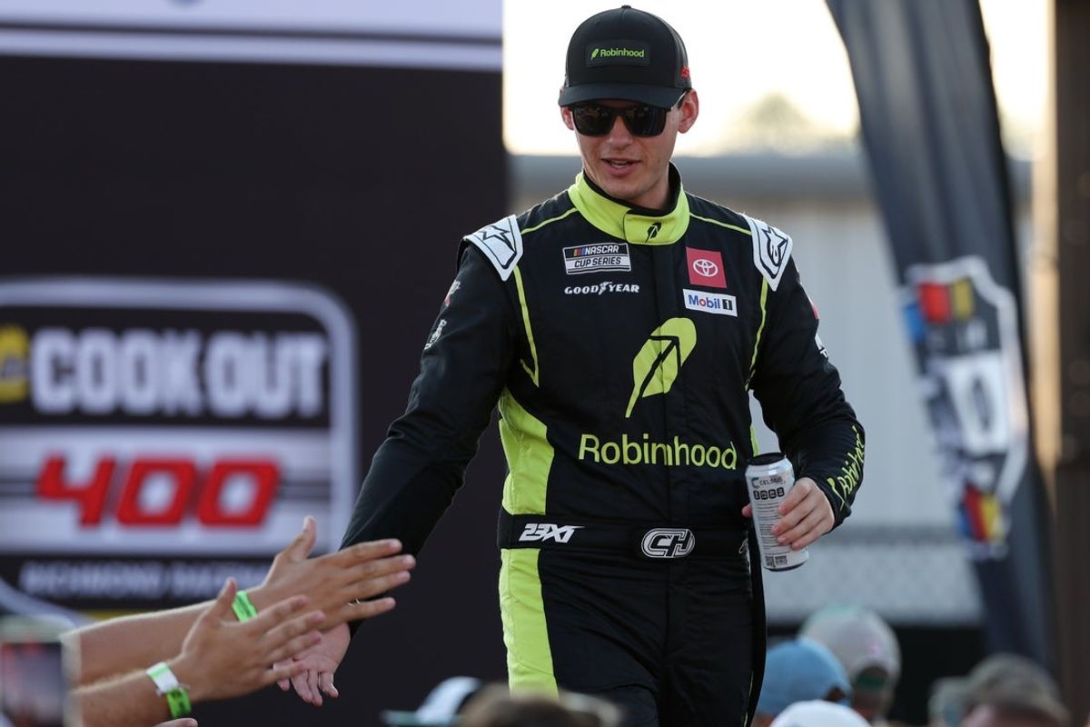 Aug 16, 2025; Richmond, Virginia, USA; NASCAR Cup Series driver Corey Heim (67) shakes hands with fans during driver introductions prior to the NASCAR Cup Series Cook Out 400 at Richmond Raceway. Mandatory Credit: Amber Searls-Imagn Images